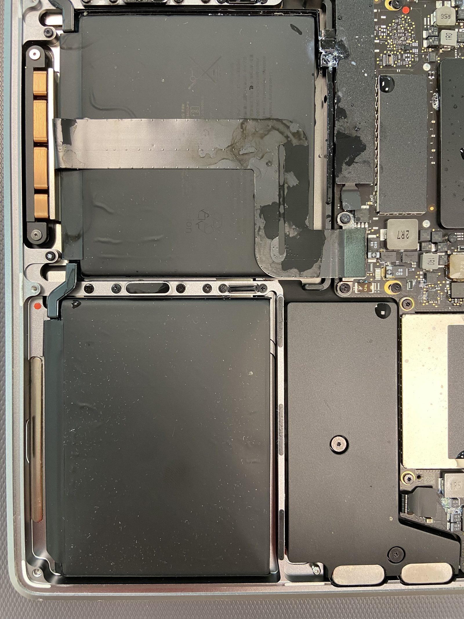 MacBook battery replacement MacBook battery and logic board exposed during a battery replacement in Dubai