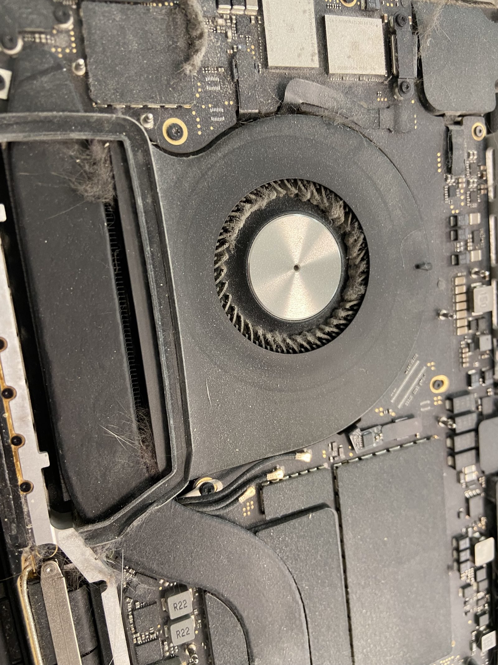 MacBook fan cleaning Close-up of a MacBook cooling fan during a fan-cleaning and overheating service